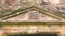 Dalquharran Castle showing 17th century extension entrance with monogram, date and Latin inscription.